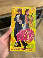 Front of Austin Powers VHS slipcase held in hand