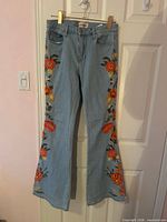 Front view of embroidered flare jeans