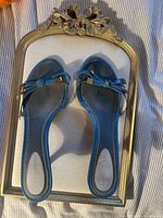 Top view of both sandals on frame