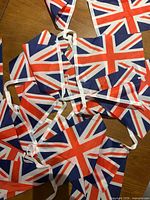 Close view of overlapping Union Jack flags on garland