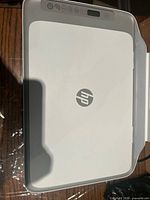 Top view showing HP logo on scanner lid