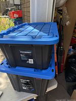Stacked Mastercraft and RamTuff totes with lids