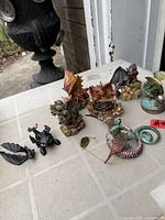 Group of five dragon figurines viewed from front