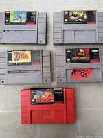 All five SNES game cartridges laid out, labels visible for identification