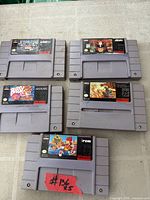 Front view of all five SNES cartridges