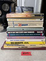 Stacked view of 11 book spines for title identification