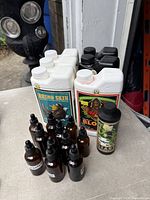 Group shot of two Rhino Skin, two Bloom, one additive bottle and eleven amber droppers