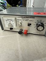 Front view showing meter, controls, binding posts, brand and model information