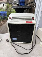 Front and side view of NSA Environmental Air System air purifier showing condition, filter, power cord