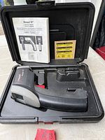 Thermometer, manual and fitted case all visible