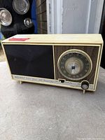 Front view showing entire Holiday solid state AM/FM radio with speaker, tuning dial, controls