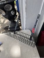 Entire basket with two adjustable brackets attached, showcasing size and condition