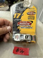Front view of sealed blister pack showing car, branding and champion details
