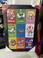 Front view of framed Super Mario wall art showing characters and frame