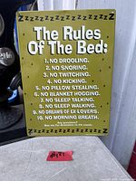 Front view of metal wall sign showing text and overall condition