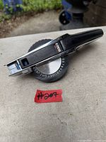 Top view showing rotating character wheel and black/chrome body