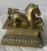 front angled view highlighting hippocampus figure and base detailing