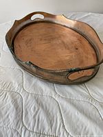 Top angled view showing copper tray, pierced gallery, twin handles, interior wear