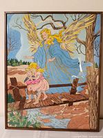 Front view of framed guardian angel painting showing artwork and frame