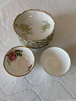 Stack of 8 matching bowls with two additional different bowls in front