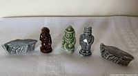 Front view of all five Wade porcelain figurines