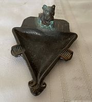 Top view of cast iron triangular ashtray with Scottie dog figure
