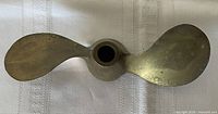 Top view of full two-blade brass propeller