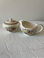 Creamer and lidded sugar bowl front view