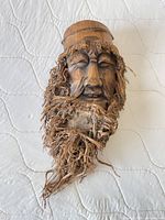 Front view of carved Shou Lao face with root beard