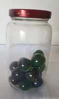 Front view of jar showing marbles inside