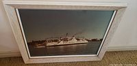 Full view of framed photograph showing ferry and frame