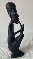 Front left view of carved ebony wood figurine