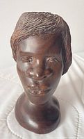 Front view of carved ironwood female bust