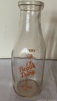 Front view showing People’s Dairy logo and skier graphic