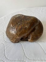 Angled top view of burl wood sculpture highlighting form and grain