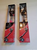 Both boxed selfie wands side by side