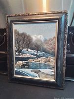 Frontal view of framed painting showing entire artwork and frame