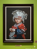 Full view of framed portrait on wall