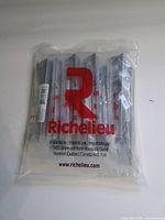 Front view of sealed Richelieu bag showing multiple individually wrapped chrome pulls