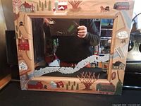 Front view of mirror showing full painted wood frame and reflective glass
