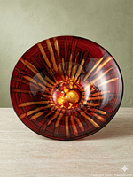 Top view showing red sunburst design and central medallion