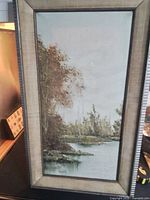 Full view of framed painting showing landscape and signature area