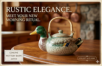 Side view of mallard duck teapot on wooden surface