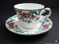 Cup on saucer, angled side view showing pattern and condition