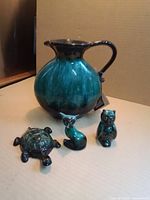 Group shot: pitcher, turtle, cat/fox, owl
