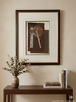 Framed collage on wall above console displaying overall presentation