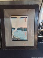 Full view of framed woodblock print in carved frame