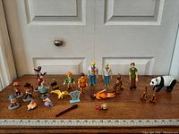 Overview of all figures arranged on wooden surface for scale reference