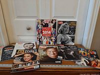 All eight magazines arranged on table for full-lot overview