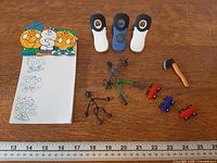 All items laid out with ruler for scale